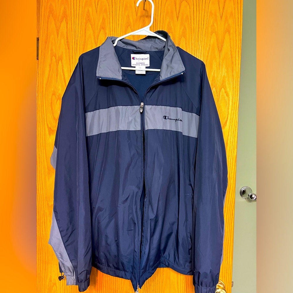 Champion windbreaker. Needs a new zipper.